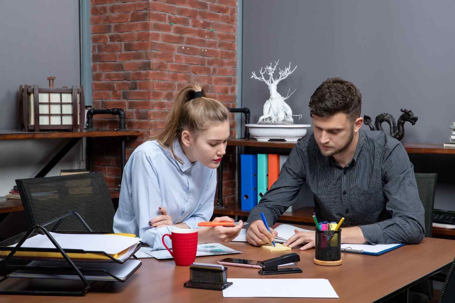 front-view-young-motivated-hardworking-office-team-focused-one-issue-office-enviroment (1).jpg